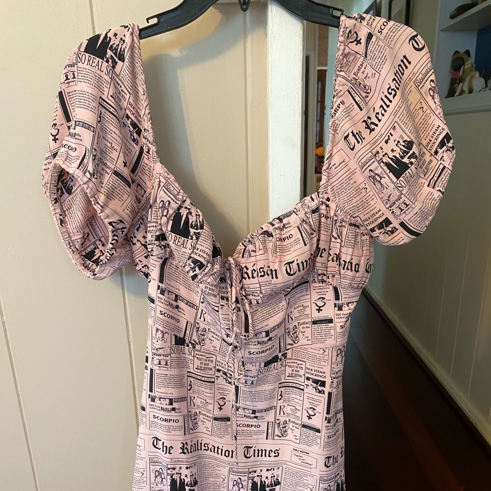 200 on🅿️!! Realisation newspaper print dress.
